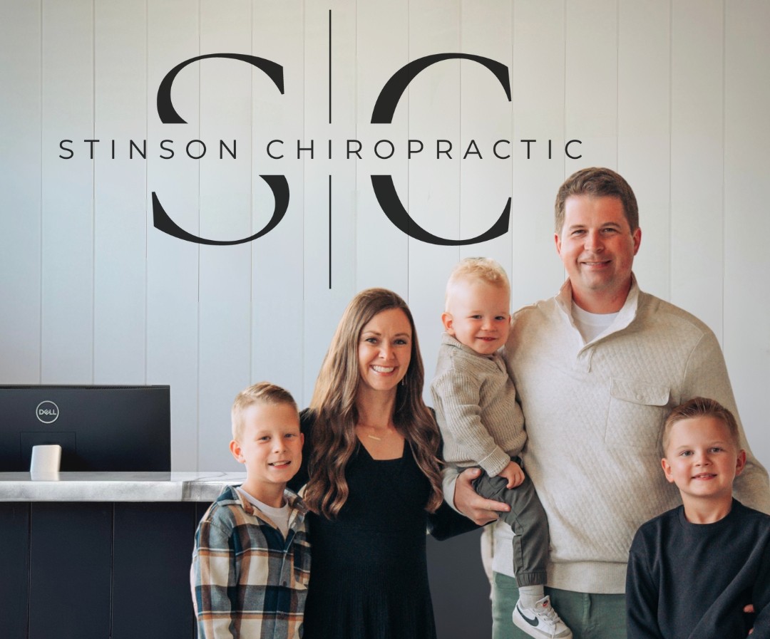 Dr. Andrew Stinson with his wife Heather and three sons Ethan Owen and Wyatt at Stinson Chiropractic in Springdale Arkansas